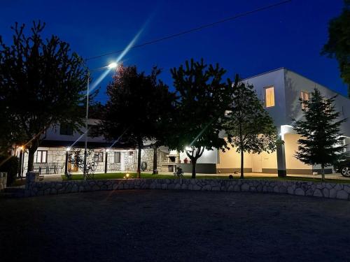 a house at night with a street light at Villa Kamena with Pool, Jacuzzi & Sauna in Grude