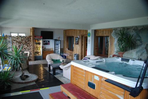 a large jacuzzi tub in a living room at Naturpark-.Weinbergferienhaus in Kitzeck im Sausal