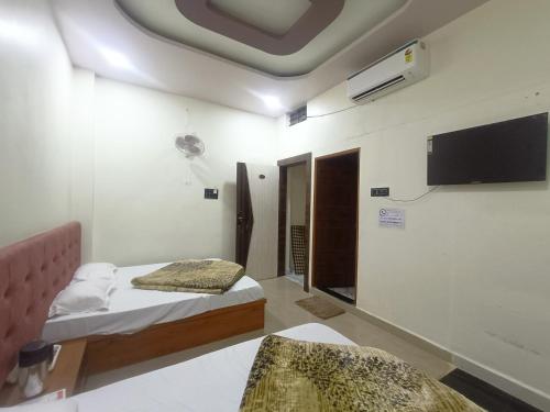 Tempat tidur dalam kamar di Hotel Shreem