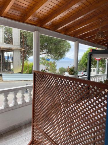 a screened in porch with a view of a street at İZAN VİLLA BAKIŞ APARTMENTS in Bodrum City