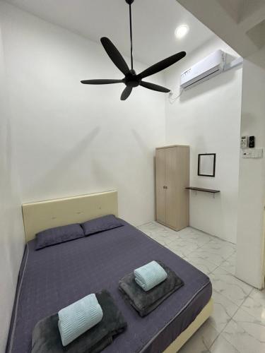 Postel nebo postele na pokoji v ubytování D’ Maziffa Homestay