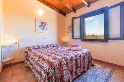 Postel nebo postele na pokoji v ubytování Rustico degli Ulivi