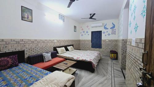 Ένα ή περισσότερα κρεβάτια σε δωμάτιο στο Jaipur View