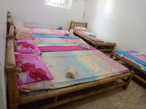 Кровать или кровати в номере Diniwid Garden Beach