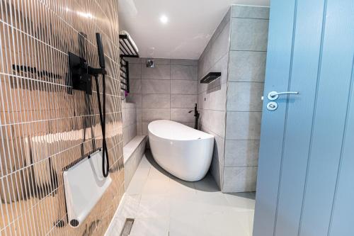 a bathroom with a toilet and a sink in it at The Log House in Ambleside