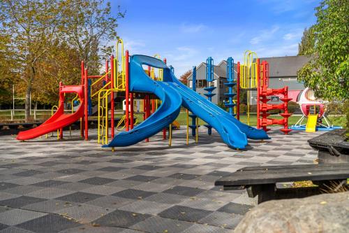 a playground with a slide in a park at Tasman Holiday Parks - Christchurch in Christchurch