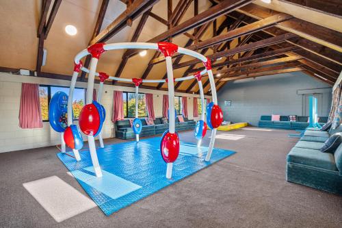a gym with red and blue swings in a room at Tasman Holiday Parks - Christchurch in Christchurch