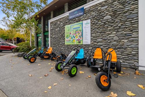 a row of scooters parked in front of a building at Tasman Holiday Parks - Christchurch in Christchurch