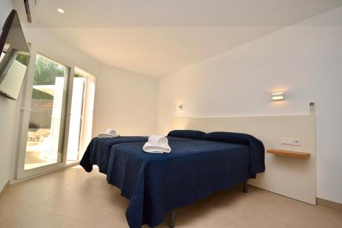 Ένα ή περισσότερα κρεβάτια σε δωμάτιο στο Villa Esmeralda