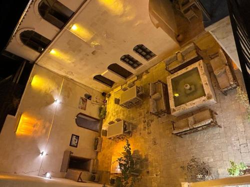 an overhead view of a room with a stone wall at Aslan Guest House in Urfa