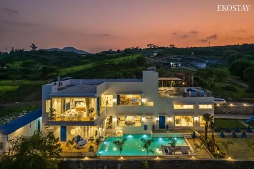 an aerial view of a house at night at EKOSTAY Luxe - Hercules Villa in Igatpuri