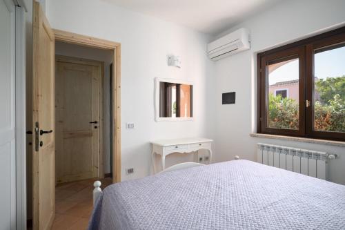 Postel nebo postele na pokoji v ubytování Il Poggio 8 - Klodge