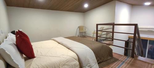 a room with a bed with a shelf in it at Woodland farm vila in Mahabaleshwar