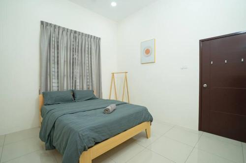 a bedroom with a bed and a window and a television at NEW-Batu Pahat 10pax Mahjong Snooker BBQ in Batu Pahat