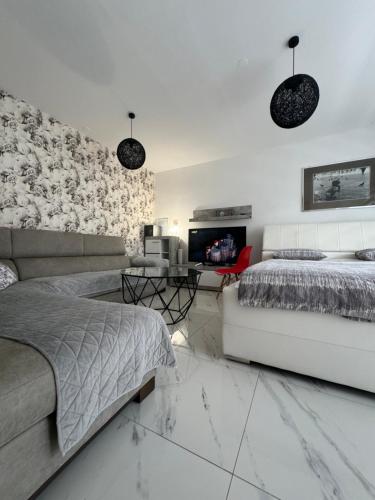 Ένα ή περισσότερα κρεβάτια σε δωμάτιο στο Apartman CITY CENTER 2