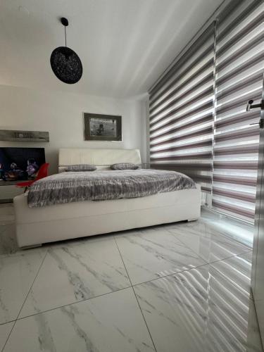 Ένα ή περισσότερα κρεβάτια σε δωμάτιο στο Apartman CITY CENTER 2