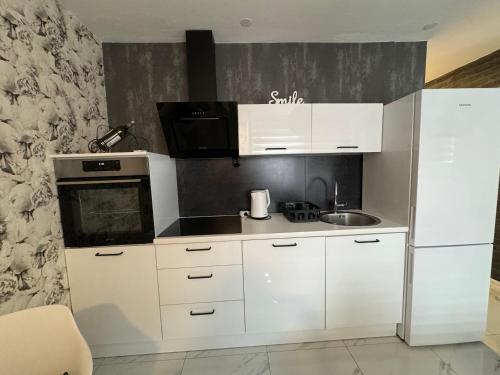 Η κουζίνα ή μικρή κουζίνα στο Apartman CITY CENTER 2