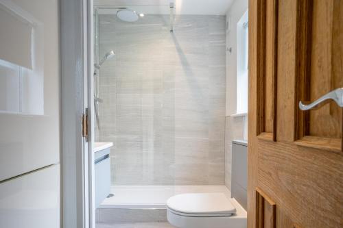 a bathroom with a toilet and a shower at 7 Buckingham Street in York