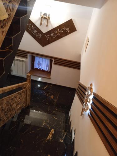 an overhead view of a lobby with a television and marble floors at Pokoje Gościnne U Moniki i Daniela in Zakopane