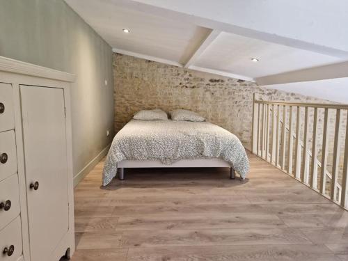Säng eller sängar i ett rum på La Maison de Condé