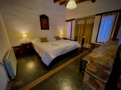 En eller flere senge i et værelse på Posada Con Los Ángeles