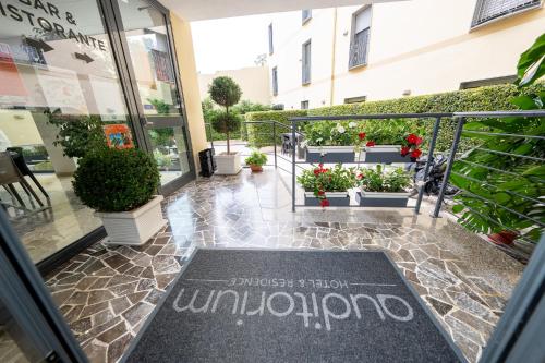 a welcome mat in front of a store door at Hotel Auditorium in Bari