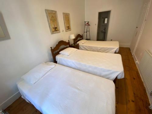 Ένα ή περισσότερα κρεβάτια σε δωμάτιο στο União - Guest House