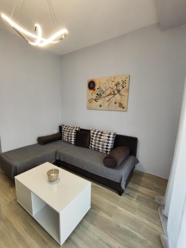 a living room with a couch and a table at Little Star in Ofrínion