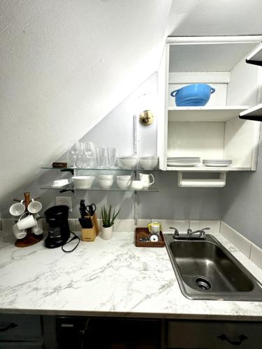 a kitchen with a sink and a counter top at Tranquil 1-Bed Apt. Private in Gastonia