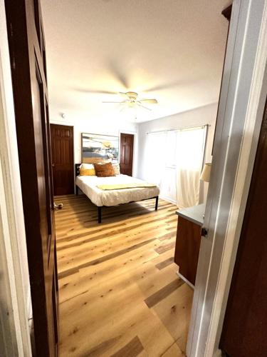 a bedroom with a bed and a ceiling fan at Tranquil 1-Bed Apt. Private in Gastonia
