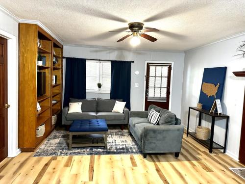 a living room with a couch and a ceiling fan at Tranquil 1-Bed Apt. Private in Gastonia