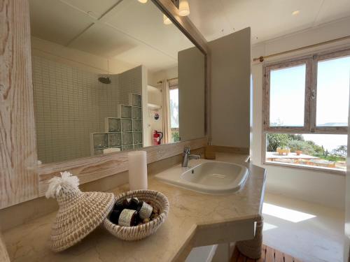a bathroom with a sink and a mirror at Lagon energy dakhla in Dakhla