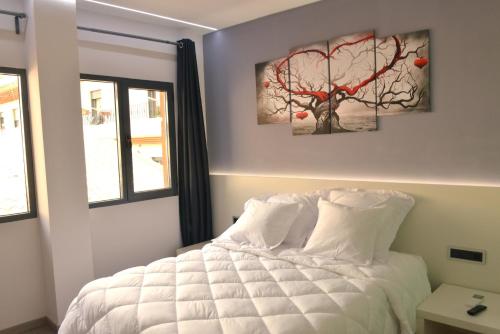 Tempat tidur dalam kamar di Alcalá del Jucar Hotel Pelayo