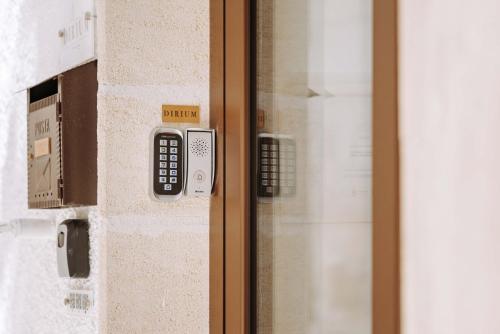 a close up of a door with a remote control at Dirium - exclusive rooms in Monopoli
