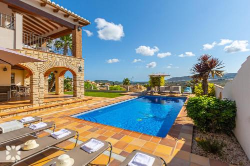an image of a villa with a swimming pool at Villa Fortezza by Abahana Villas in Benitachell