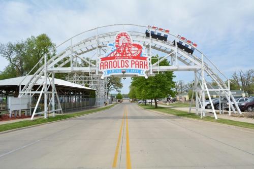 a fork in the road with arothos point sign in the middle at BOHO Bungalow on the Pond w/ Hot Tub in Arnolds Park