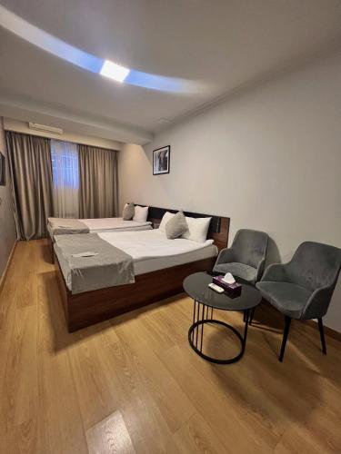 Postel nebo postele na pokoji v ubytování Mashtots Hotel