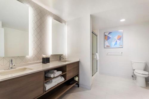 a bathroom with a sink and a toilet at Comfort Suites Gatlinburg Downtown-Convention Center in Gatlinburg