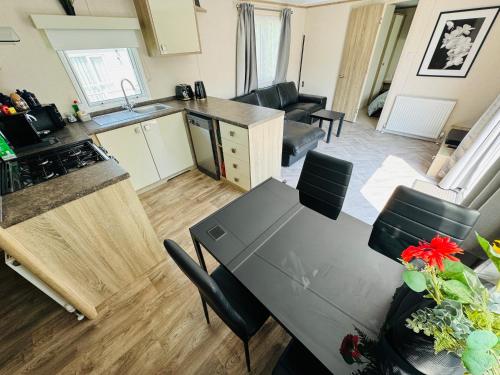 an aerial view of a kitchen and living room with a table at Rosa - Bournemouth Holiday Home in Wimborne Minster