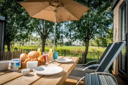 a table with a basket of fruit on it at Holiday Village Knokke in Knokke-Heist