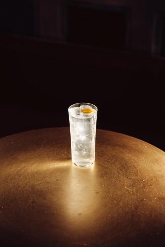a glass of water sitting on top of a table at Palazzo Petrvs in Orvieto