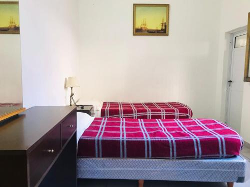 Ένα ή περισσότερα κρεβάτια σε δωμάτιο στο Hotel Piamonte