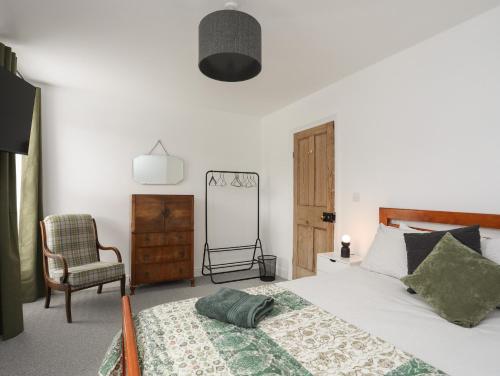 Ένα ή περισσότερα κρεβάτια σε δωμάτιο στο Maes Y Ddol