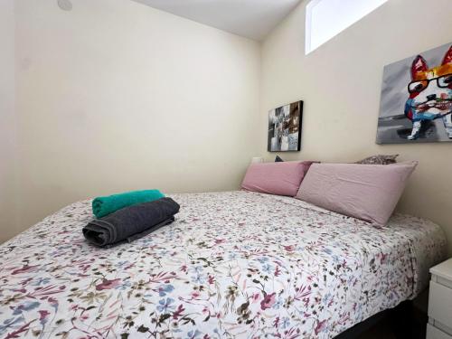 a bedroom with a bed with a colorful comforter at VER855 - Playa y Centrico, Wifi, Fire Stick, Vistas al mar in Torremolinos