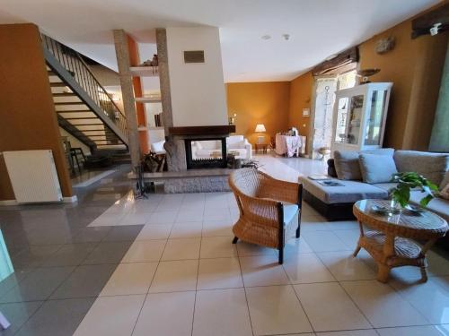 a living room with a couch and a fireplace at Hotel Boutique Villa de Palacios in San Miguel de Aras