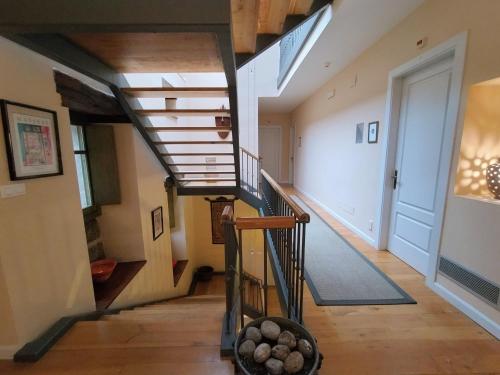 a hallway with a spiral staircase in a house at Hotel Boutique Villa de Palacios - Palacio de Aras in San Miguel de Aras