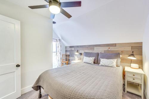 a bedroom with a bed and a ceiling fan at Lovely Ludlow Farmhouse about 1 Mi to Town and Slopes! in Ludlow