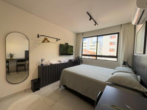 Una cama o camas en una habitación de PERFEIÇÃO do Cabo Branco - FLAT a 4 minutos da Praia