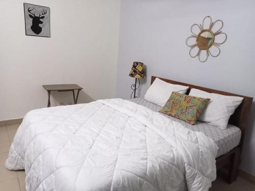 Ένα ή περισσότερα κρεβάτια σε δωμάτιο στο Mienmo Residence
