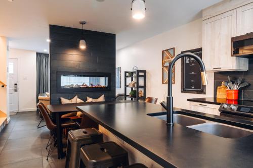 a kitchen with a sink and a counter top at Le Sous-Bois 1320 in Mont-Blanc